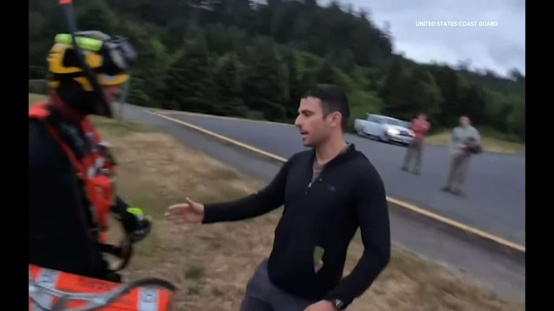 owner thanking the aircrew for saving his dog