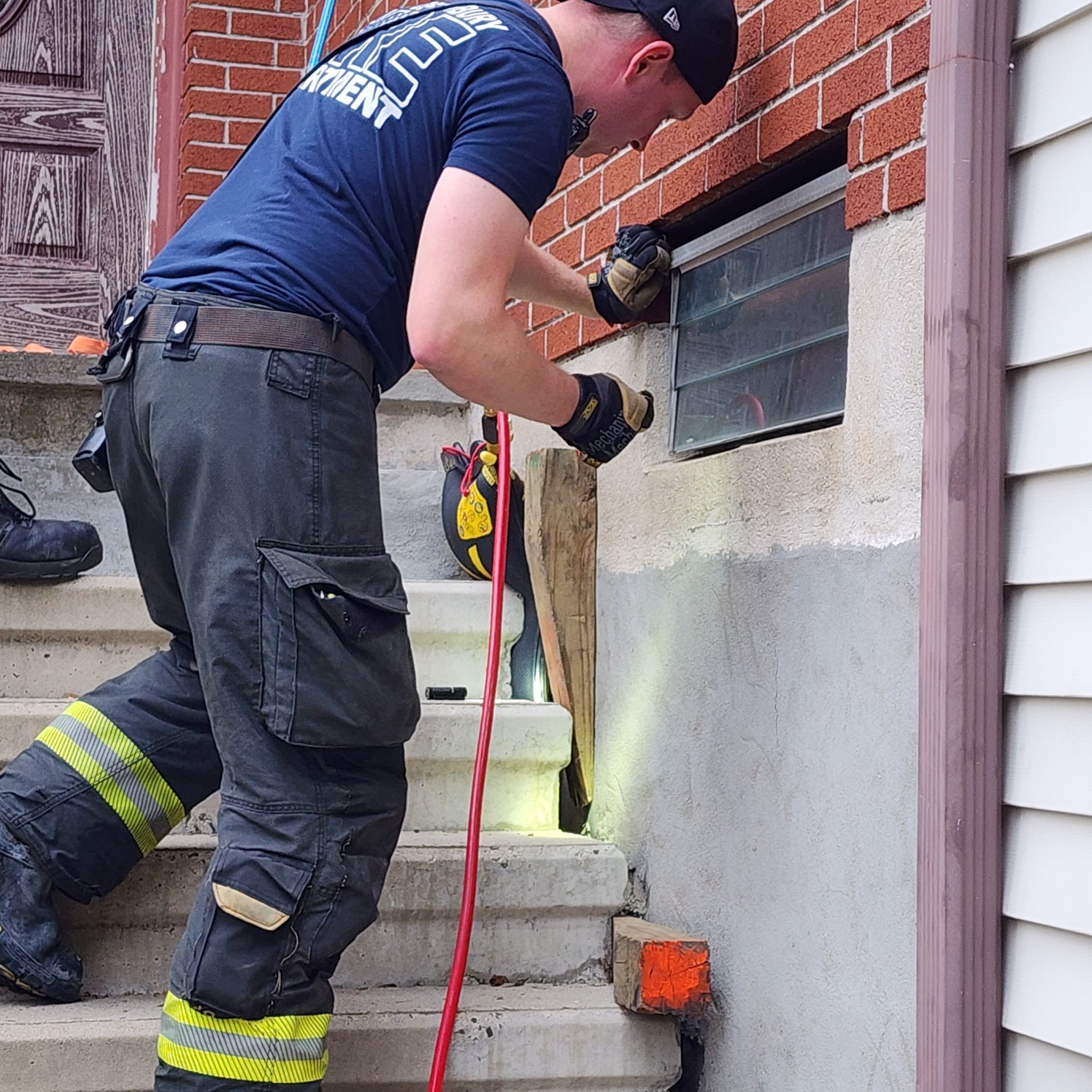 a firefighter trying to rescue kittens