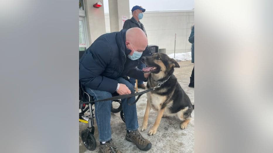 a man petting a rescue dog