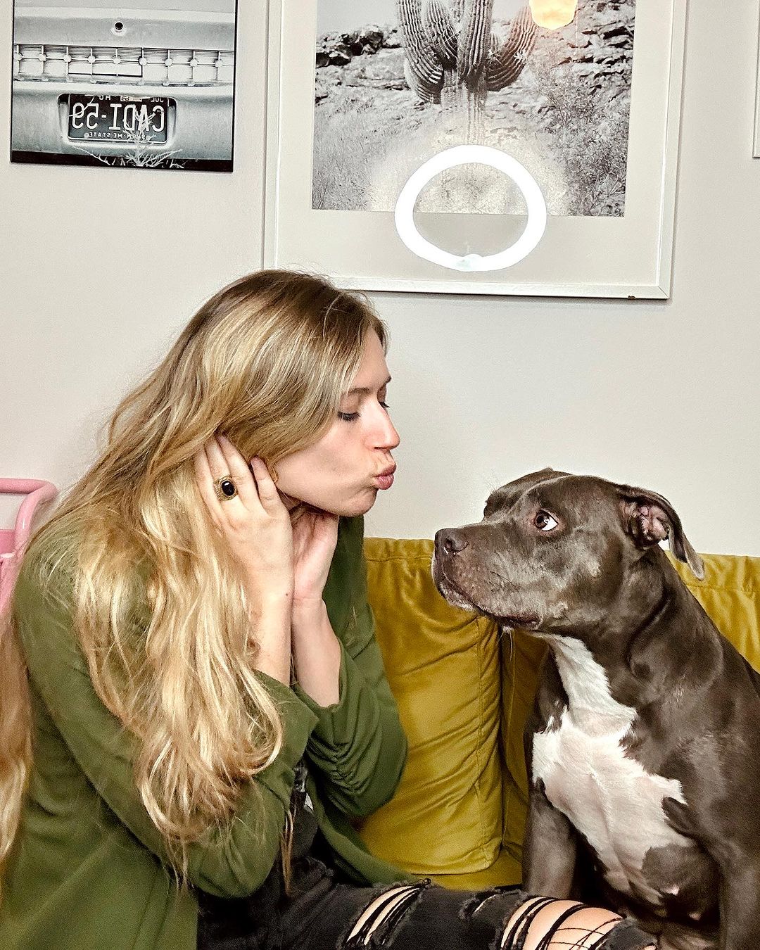 blonde girl and her black dog