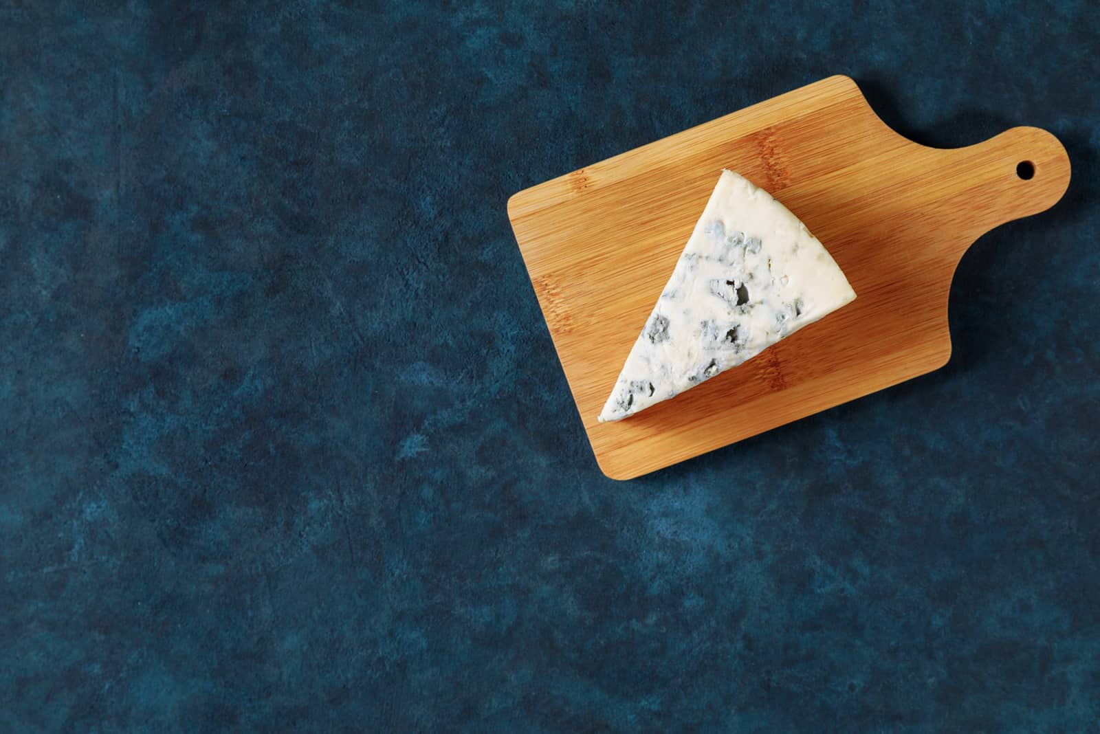 Blue cheese on a cutting board