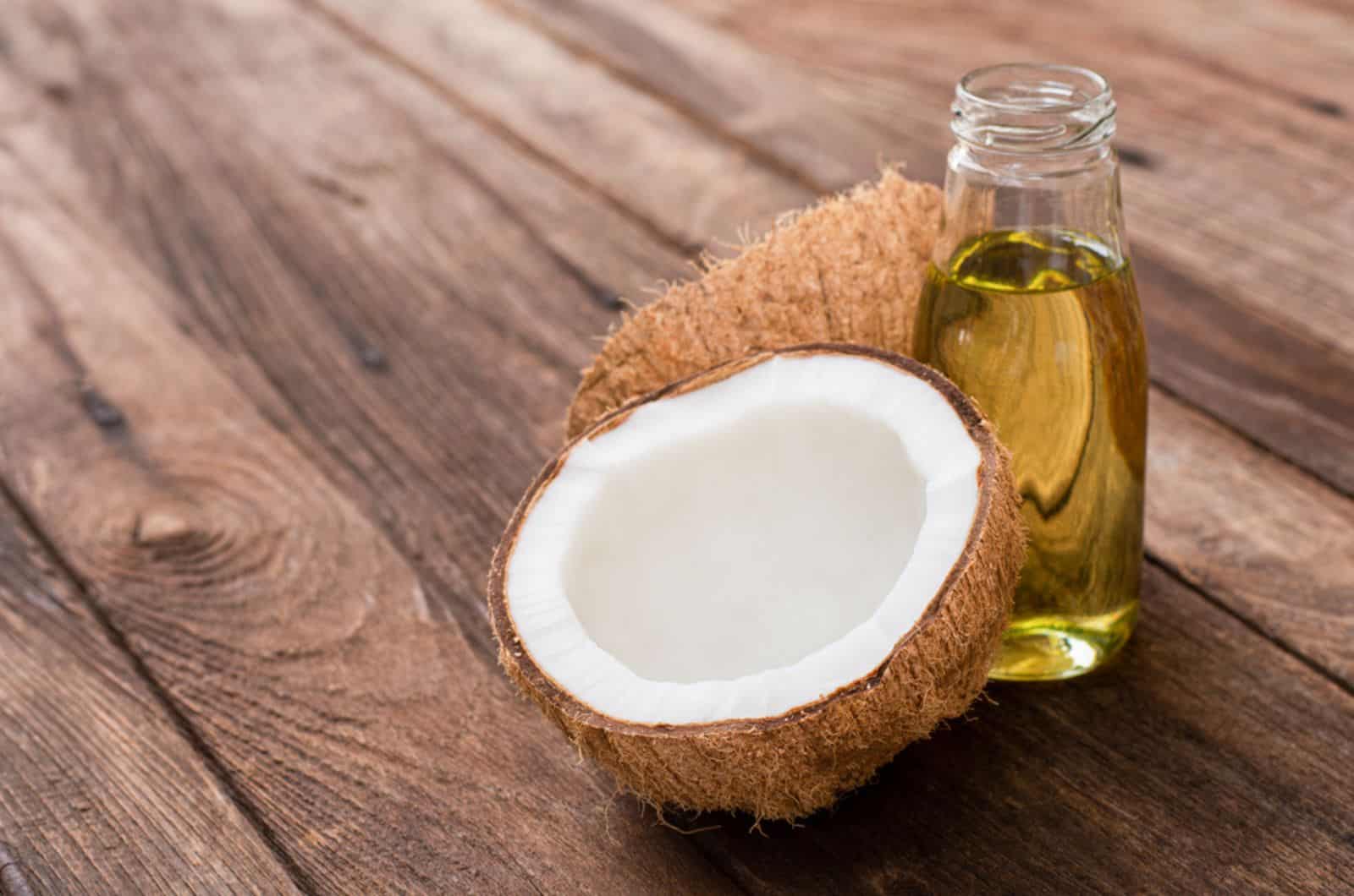 coconut and coconut oil on wooden table