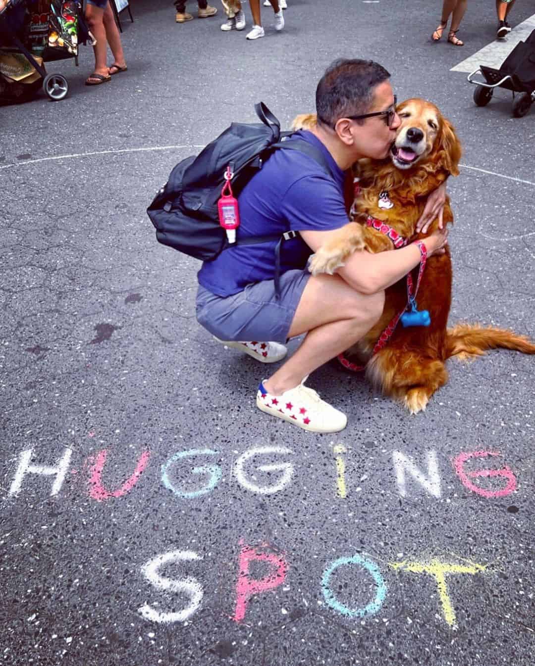 Dog and guy standing in hugging zone