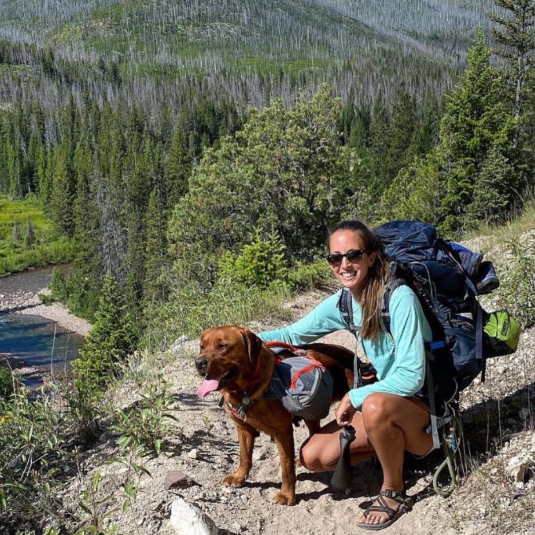 dog and his owner hiking