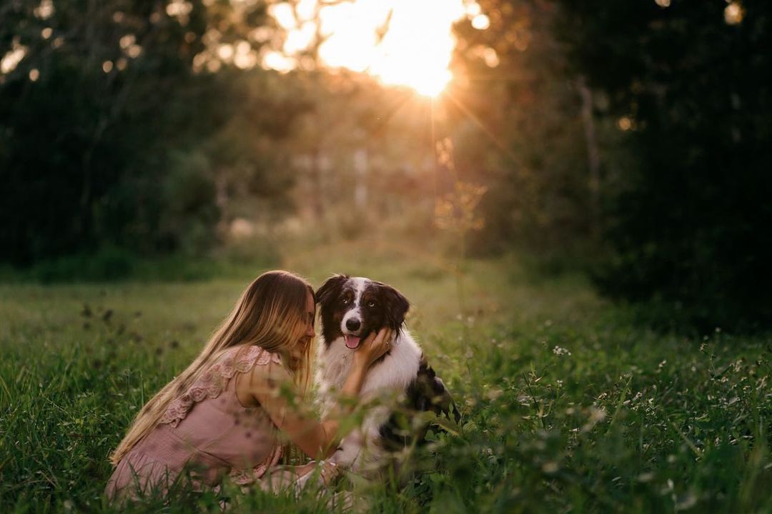 dog echo and his owner in tall grass