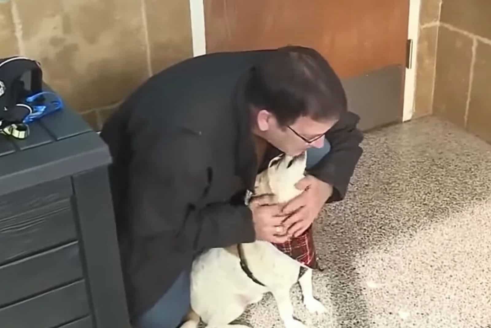 dog kissing man