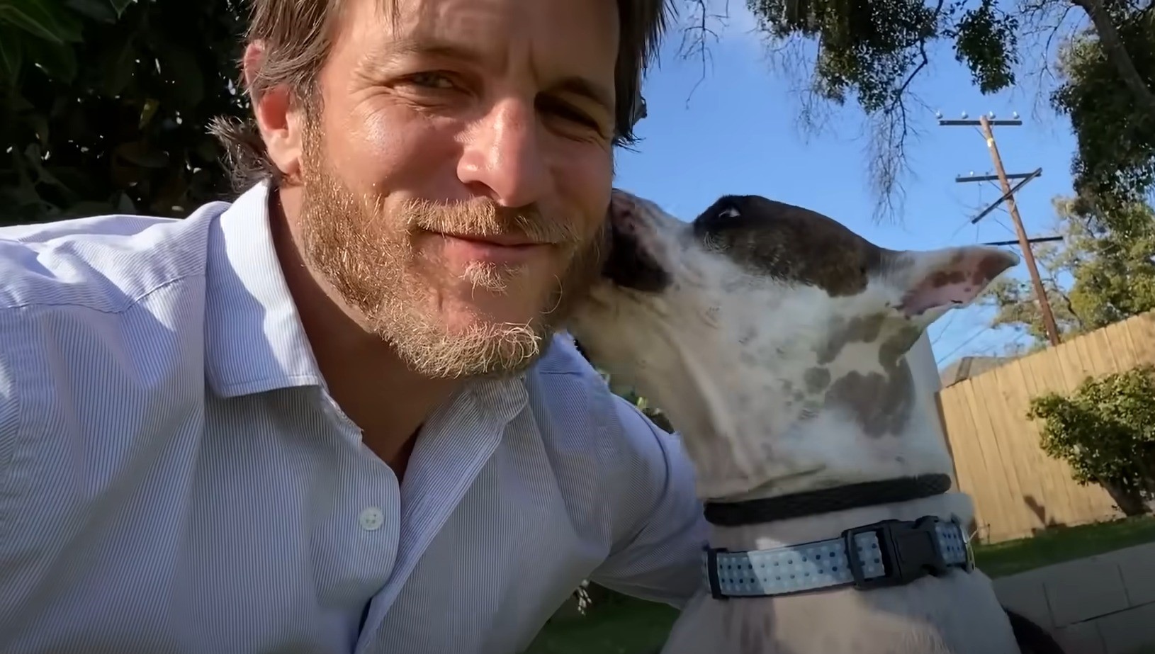 dog licking mans face