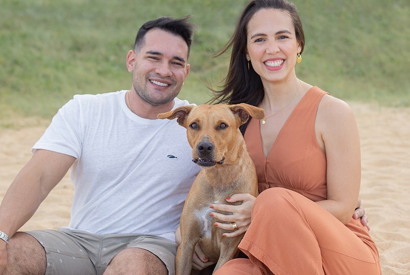 family with dog posing