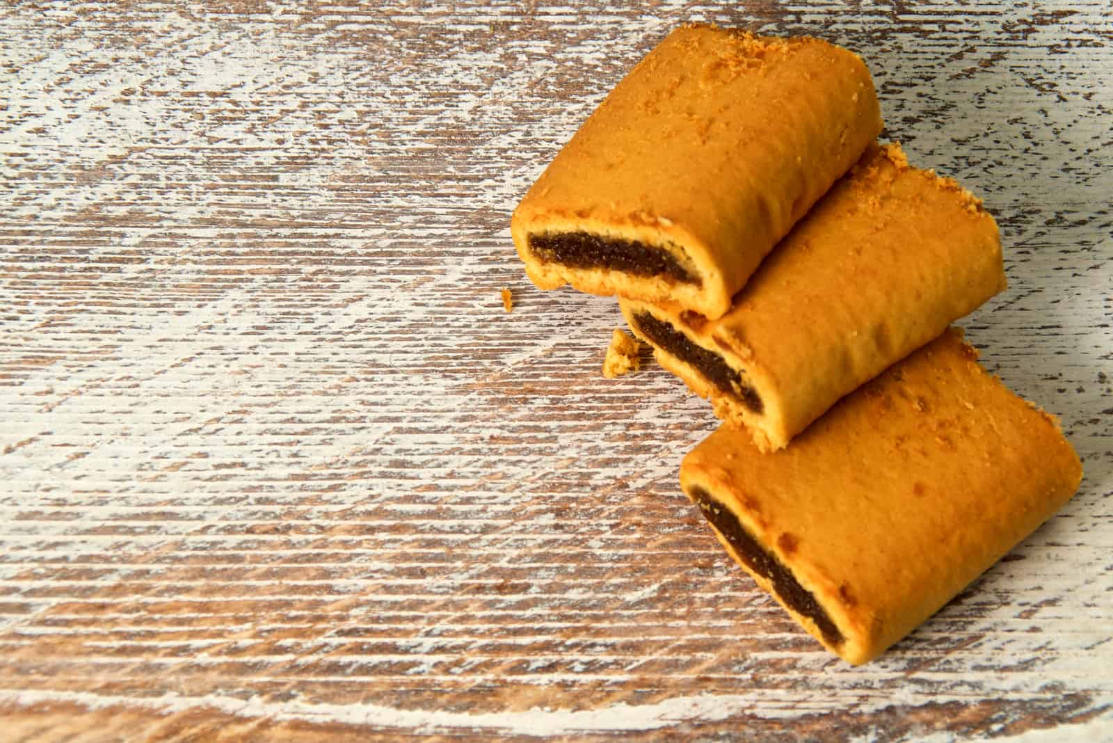 fig bar cookies on old wooden background