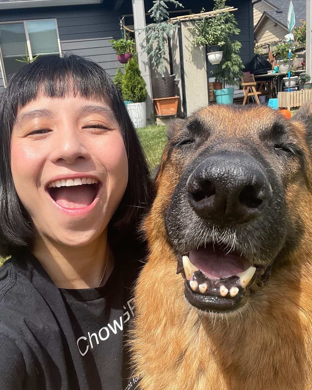 rambo the german shepherd and his owner posing for a photo