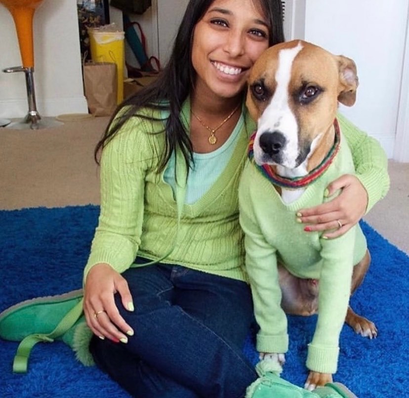 girl hugging her dog