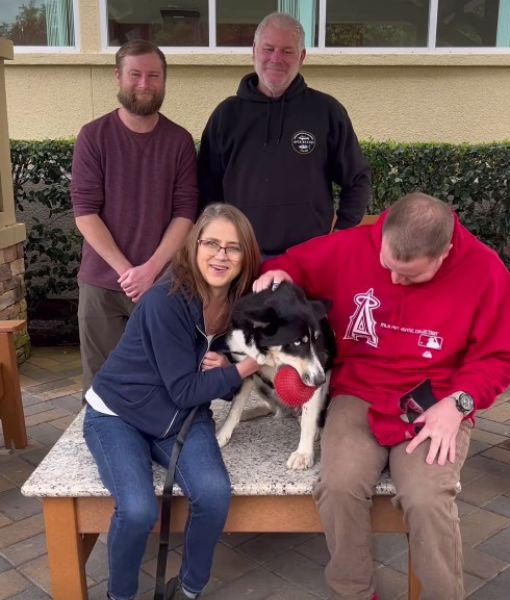 group of people with the dog