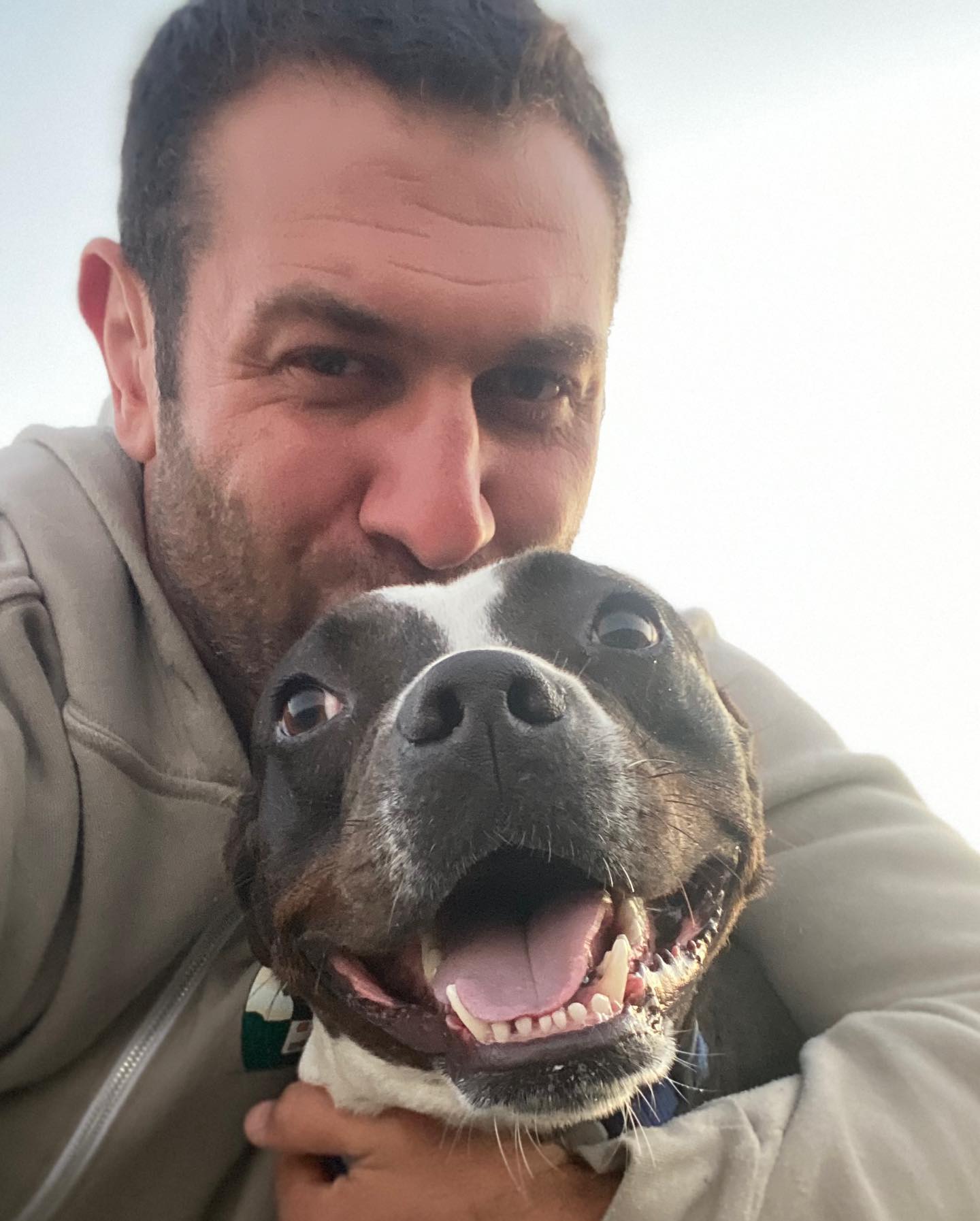 guy hugging a dog