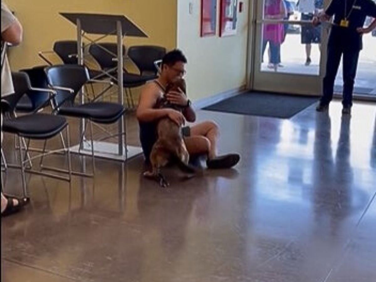 guy hugging his dog