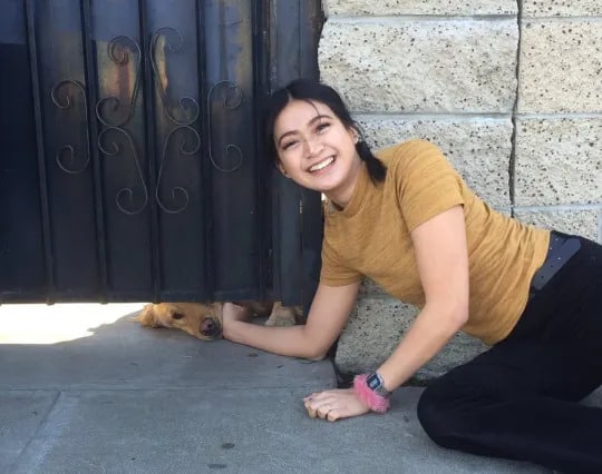 happy girl petting the dog