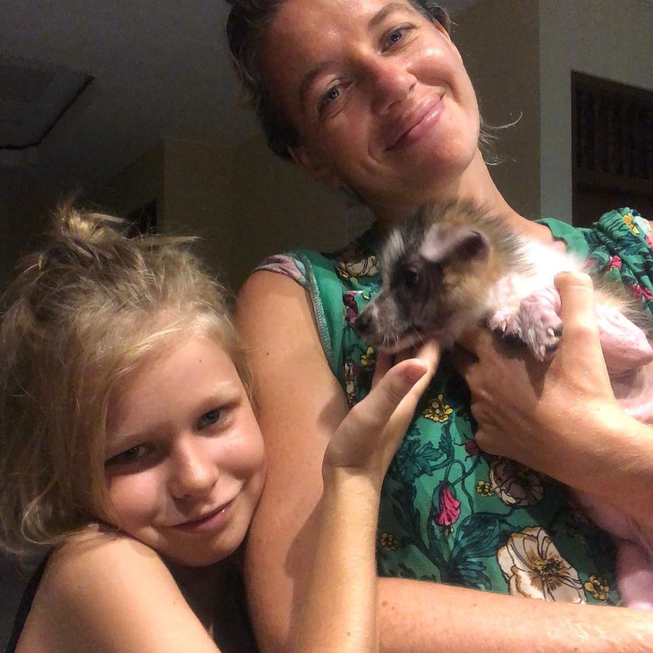 happy mother and daughter with puppy