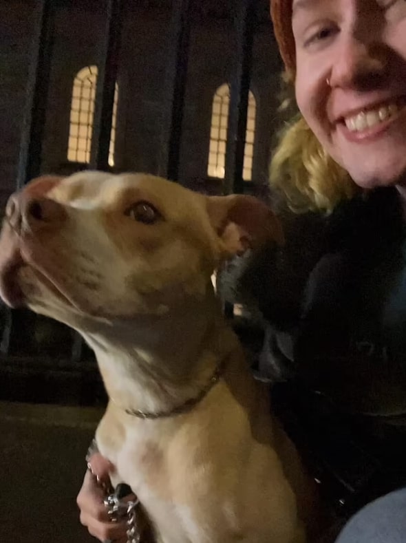 happy woman smiling with dog