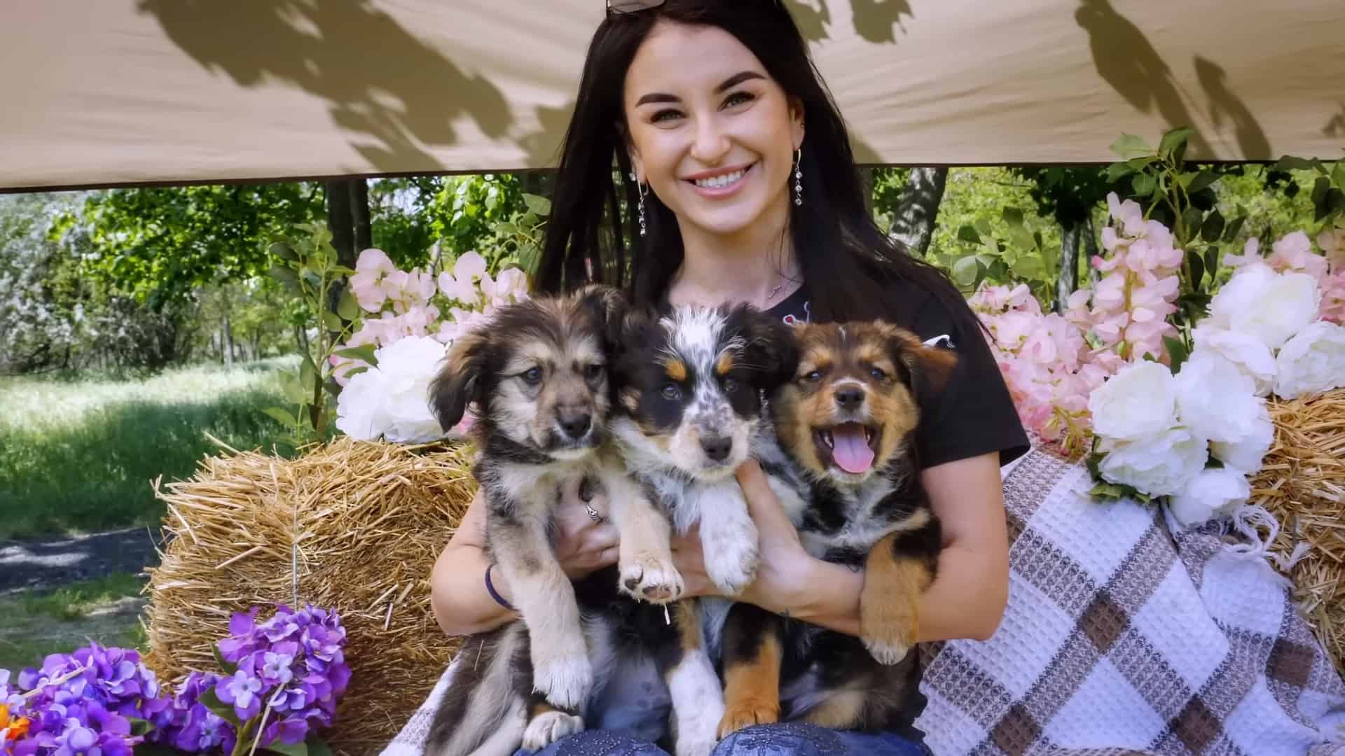 happy woman with puppies