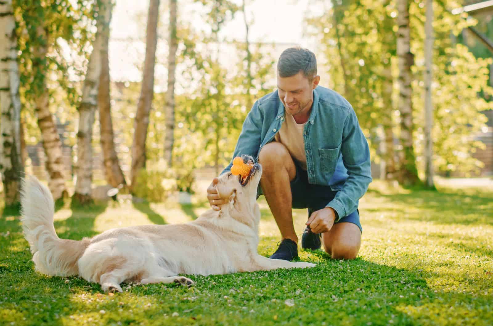 Man playing with his dog