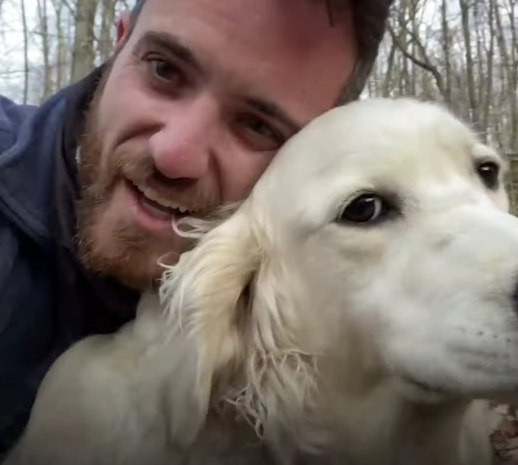 owner and his white dog