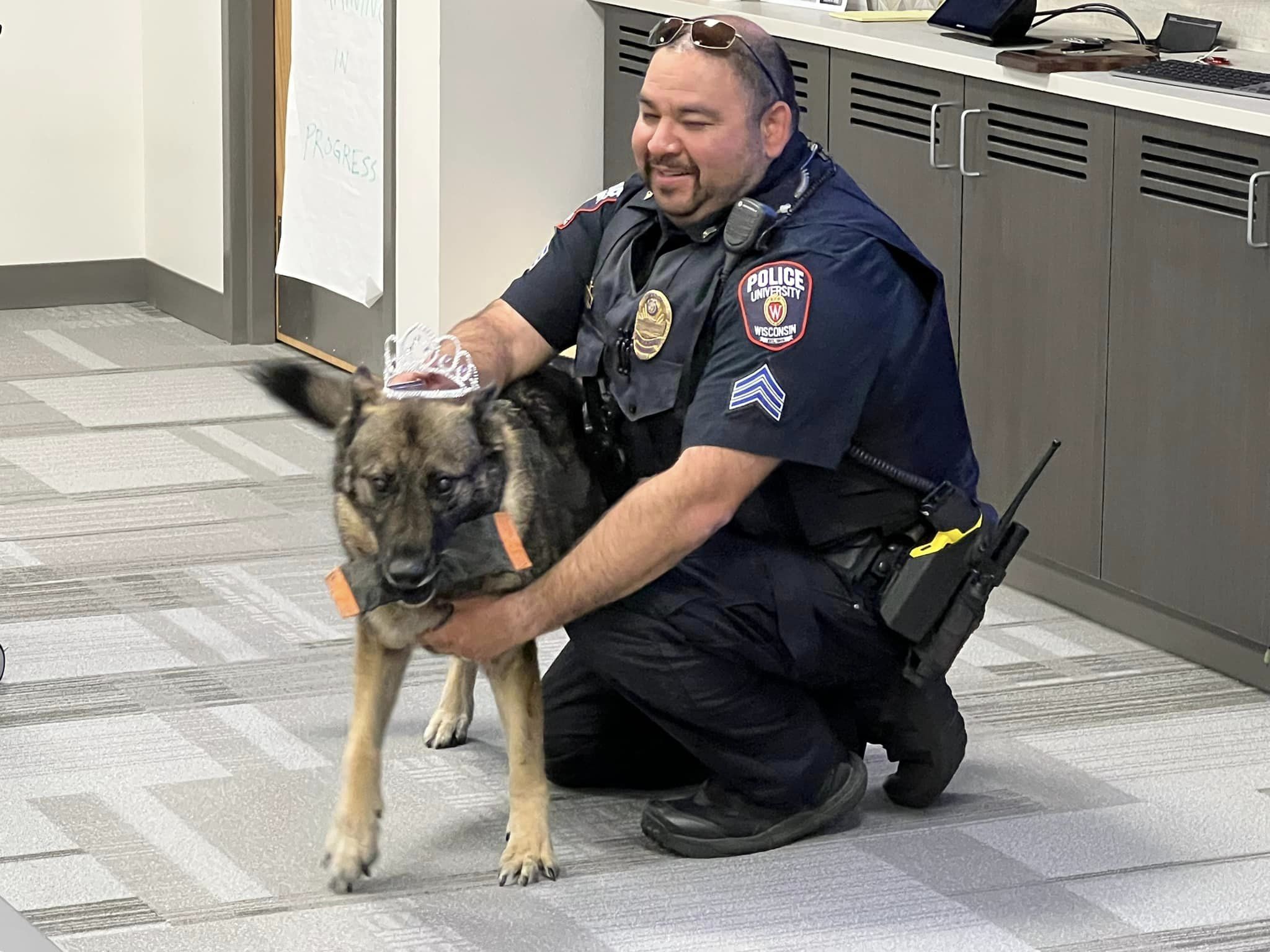 photo of dog maya with an officer