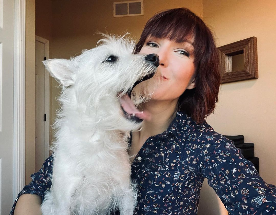 photo of female musician and dog