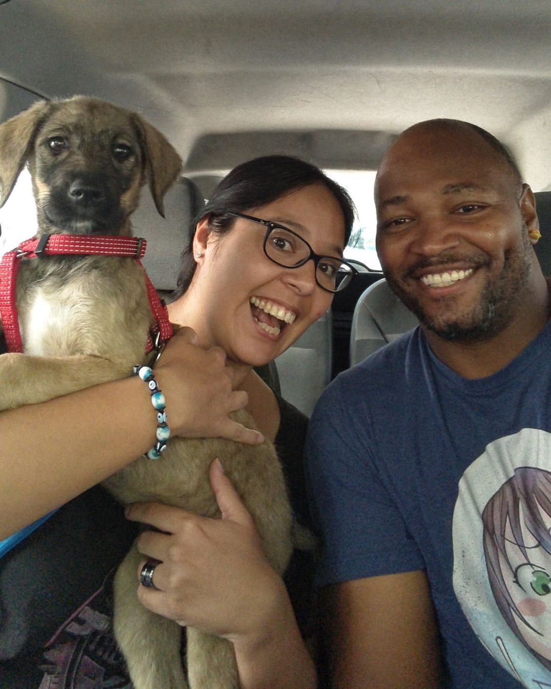 photo of man woman and a dog