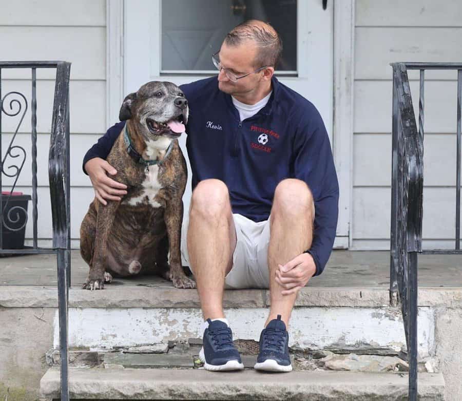 photo of Mellow, a dog with terminal cancer, and his owner