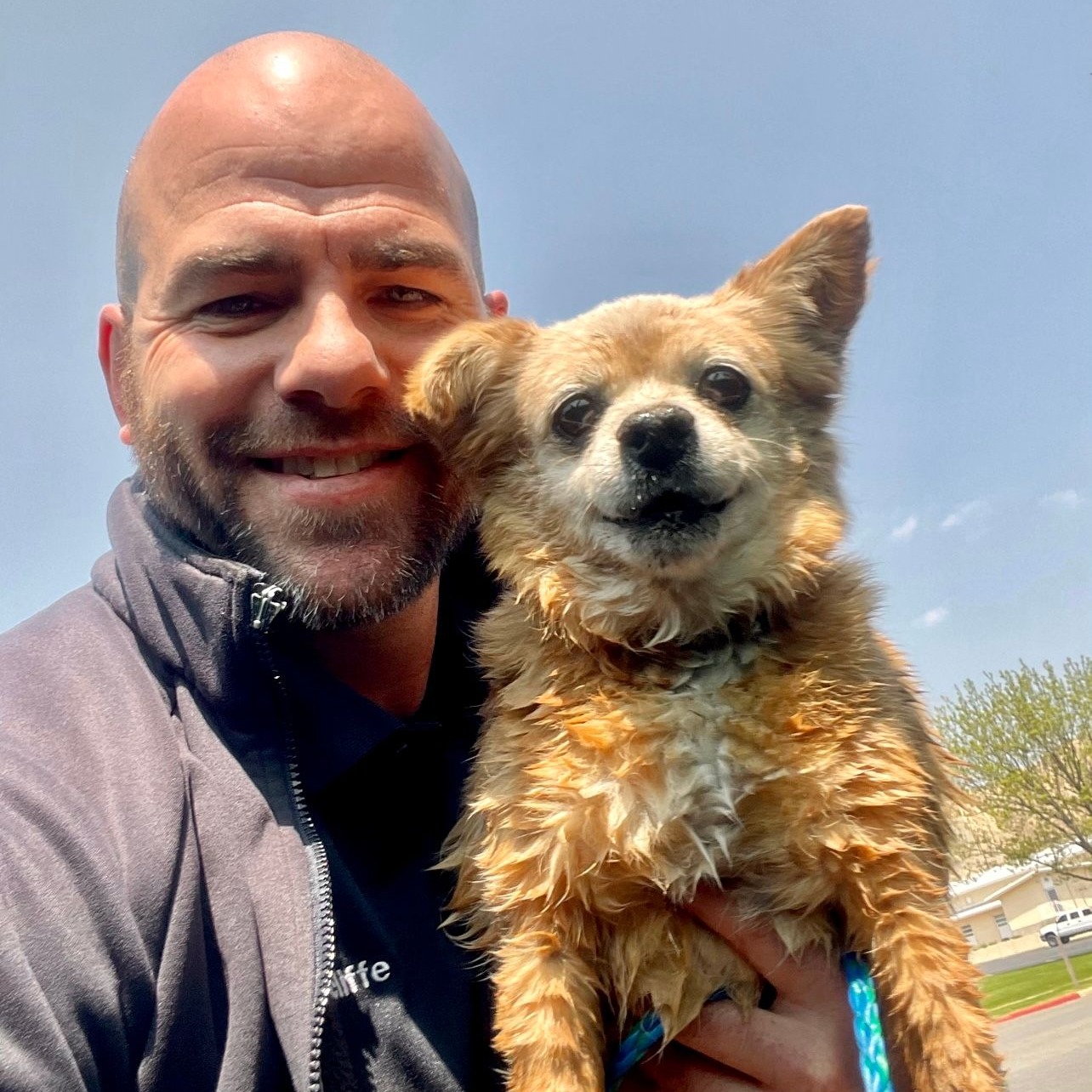 photo of the man and a dog from the canal