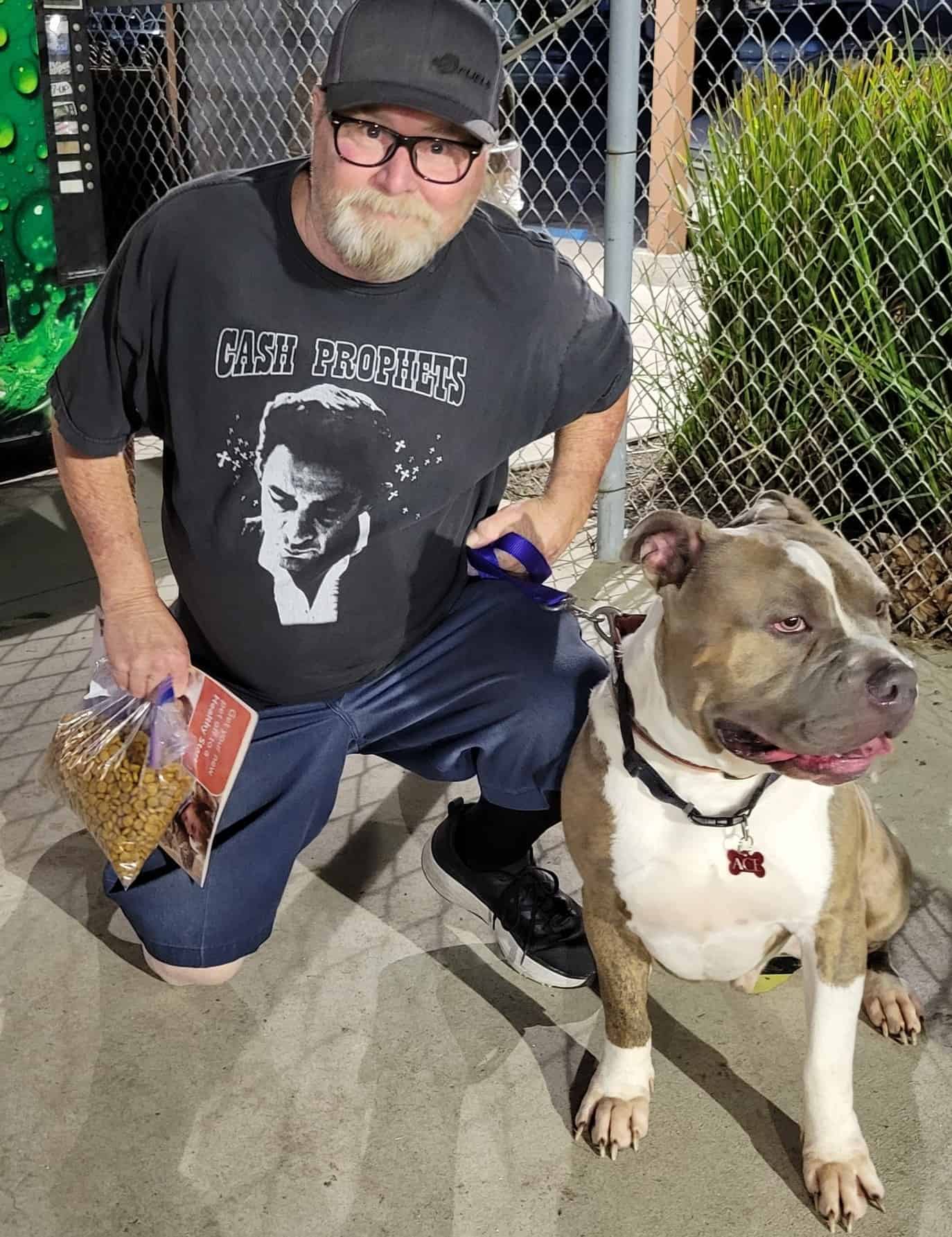 pitbull sitting by his new owner