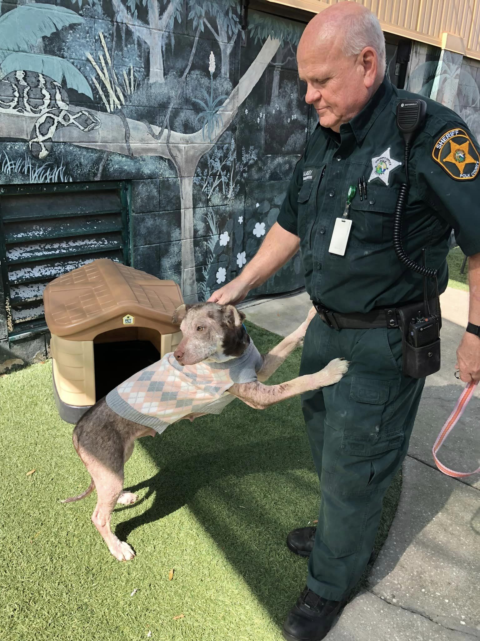 Police officer and newly adopted dog