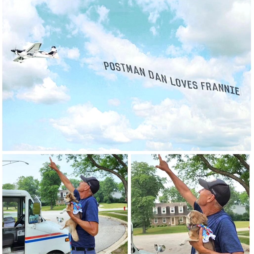 postman with dog looking at sky with a sign