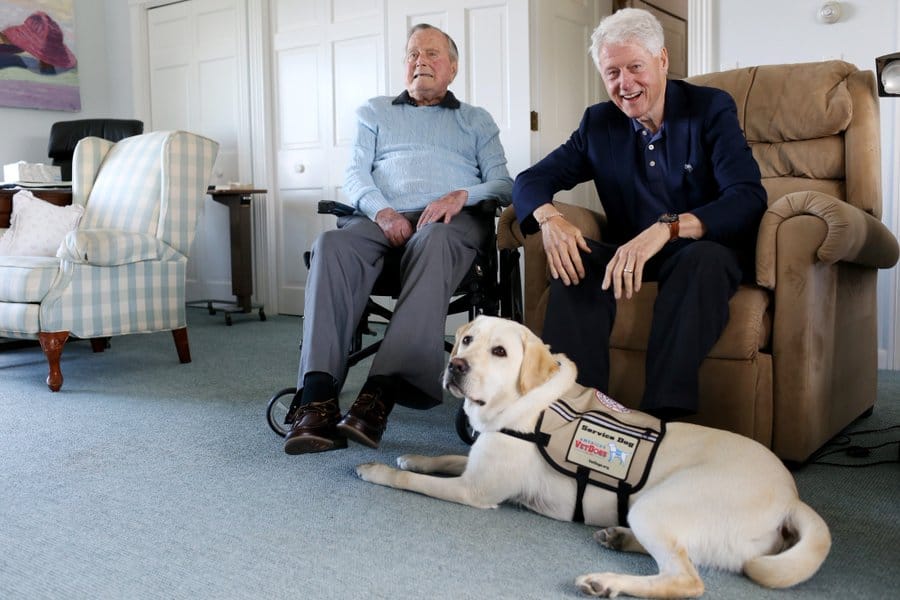 president and bill clinton with dog