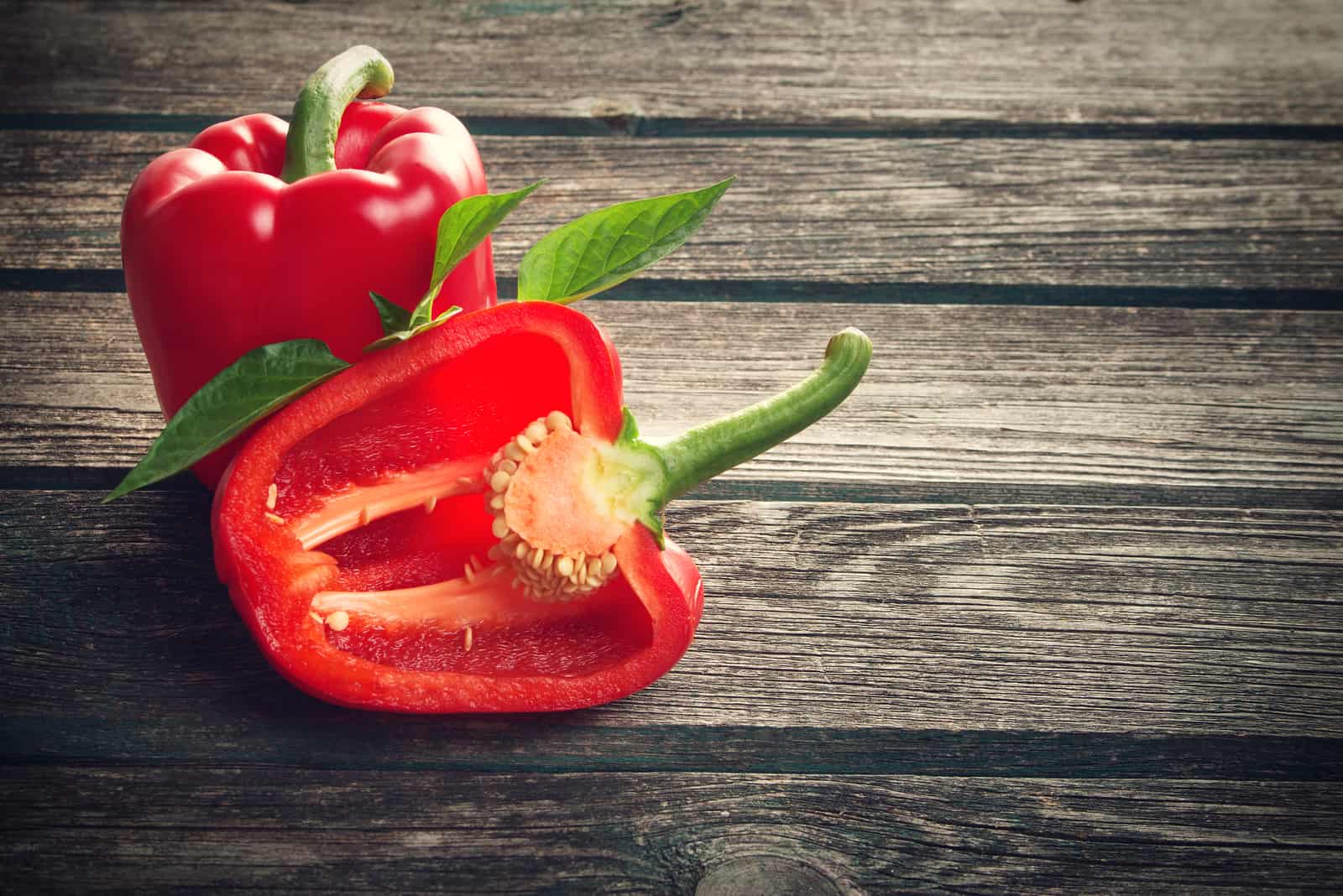 fresh red pepper on old wooden table