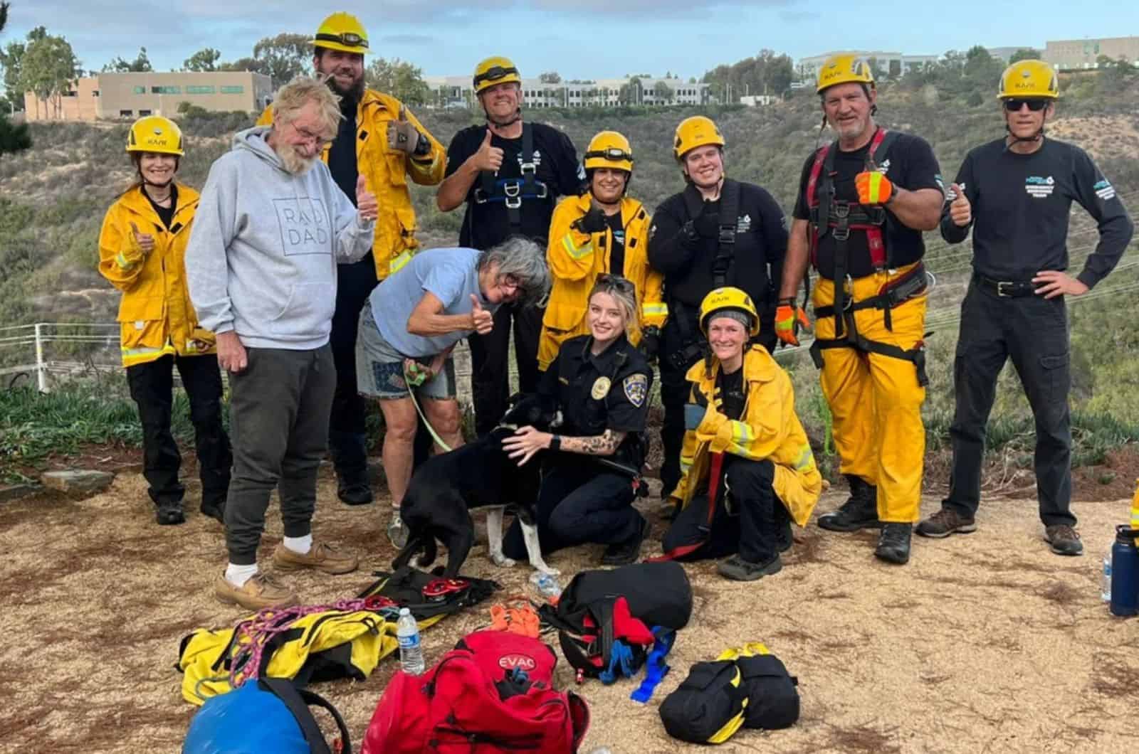 rescue crew with german shepherd dog saved from ravine