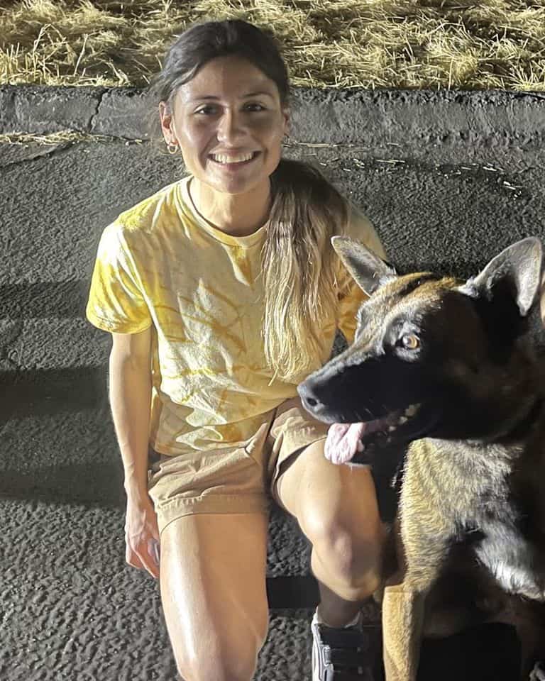 smiling girl with german shepherd