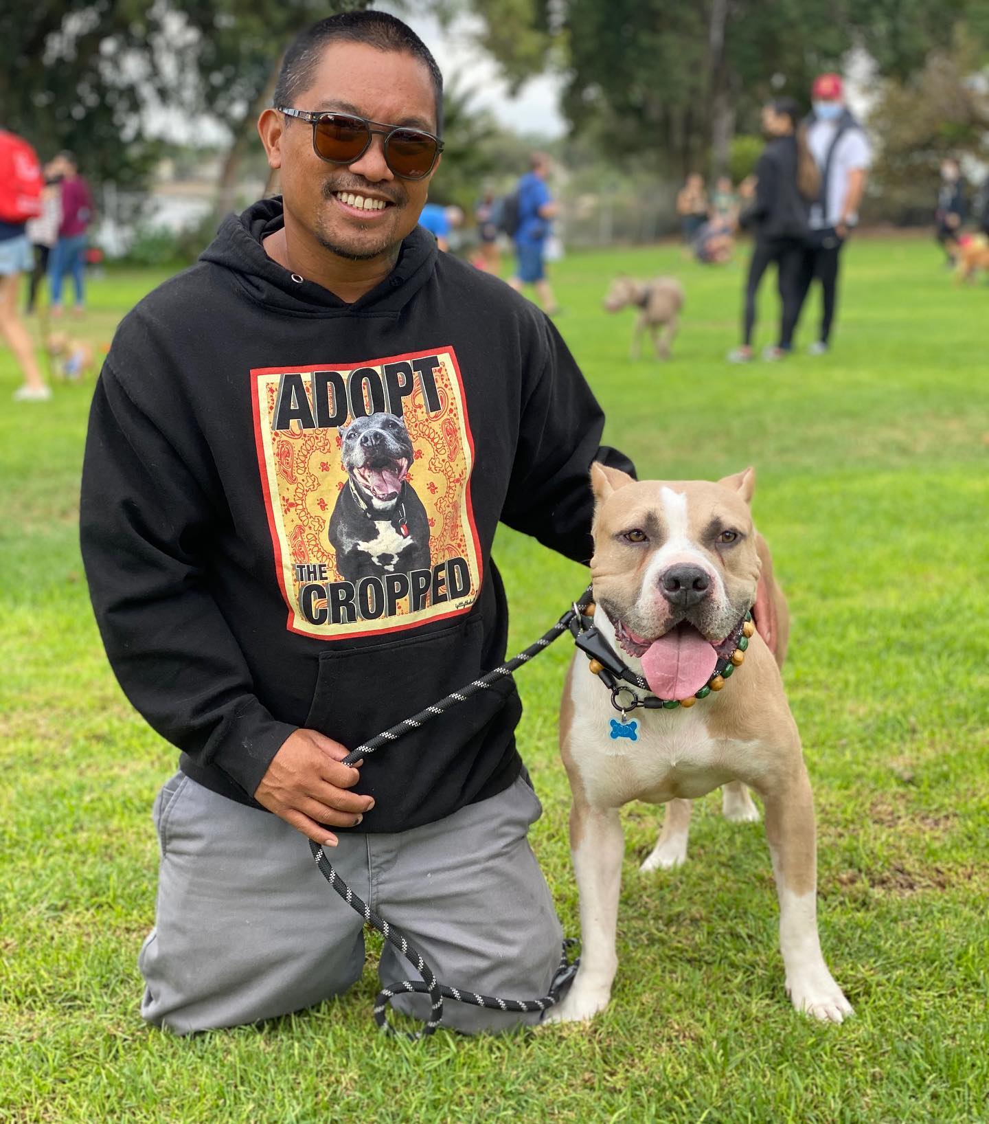 smiling man with dog posing