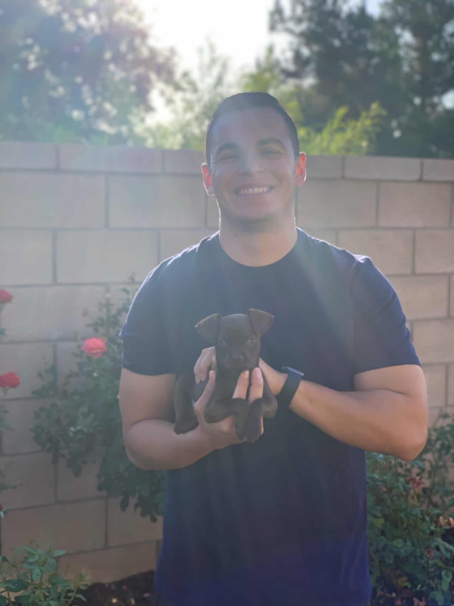 smiling man with tiny dog