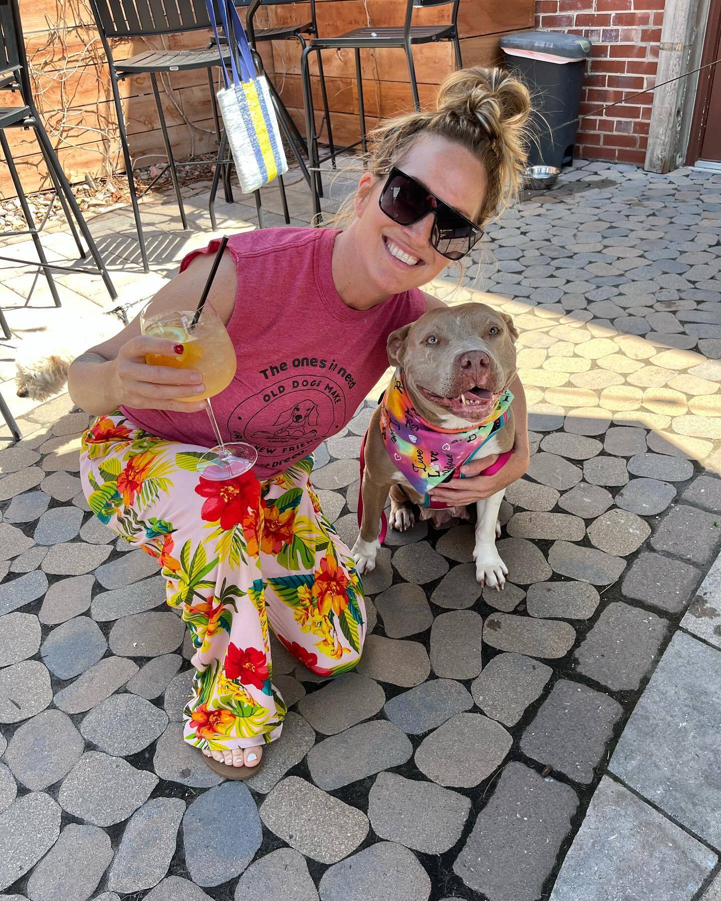 smiling woman posing with dog