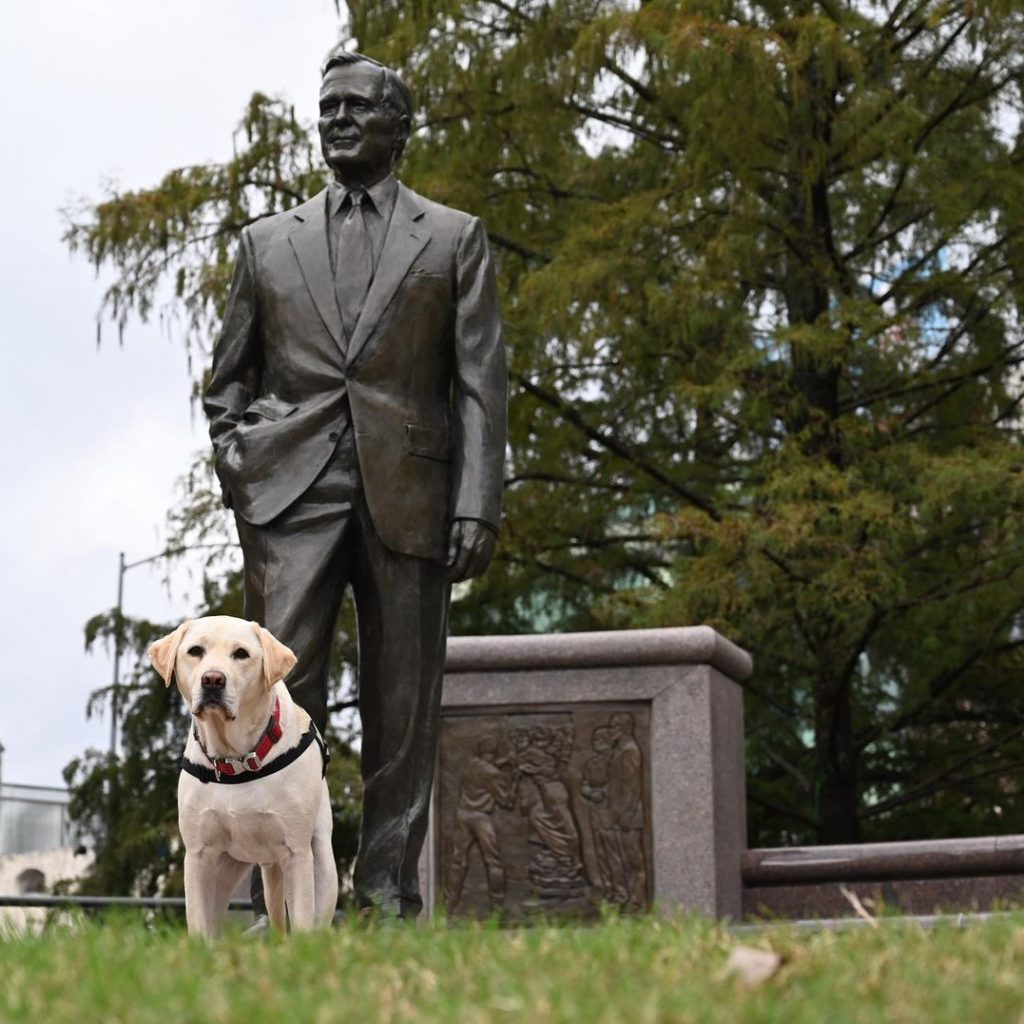 sully in front of the statue of president bush