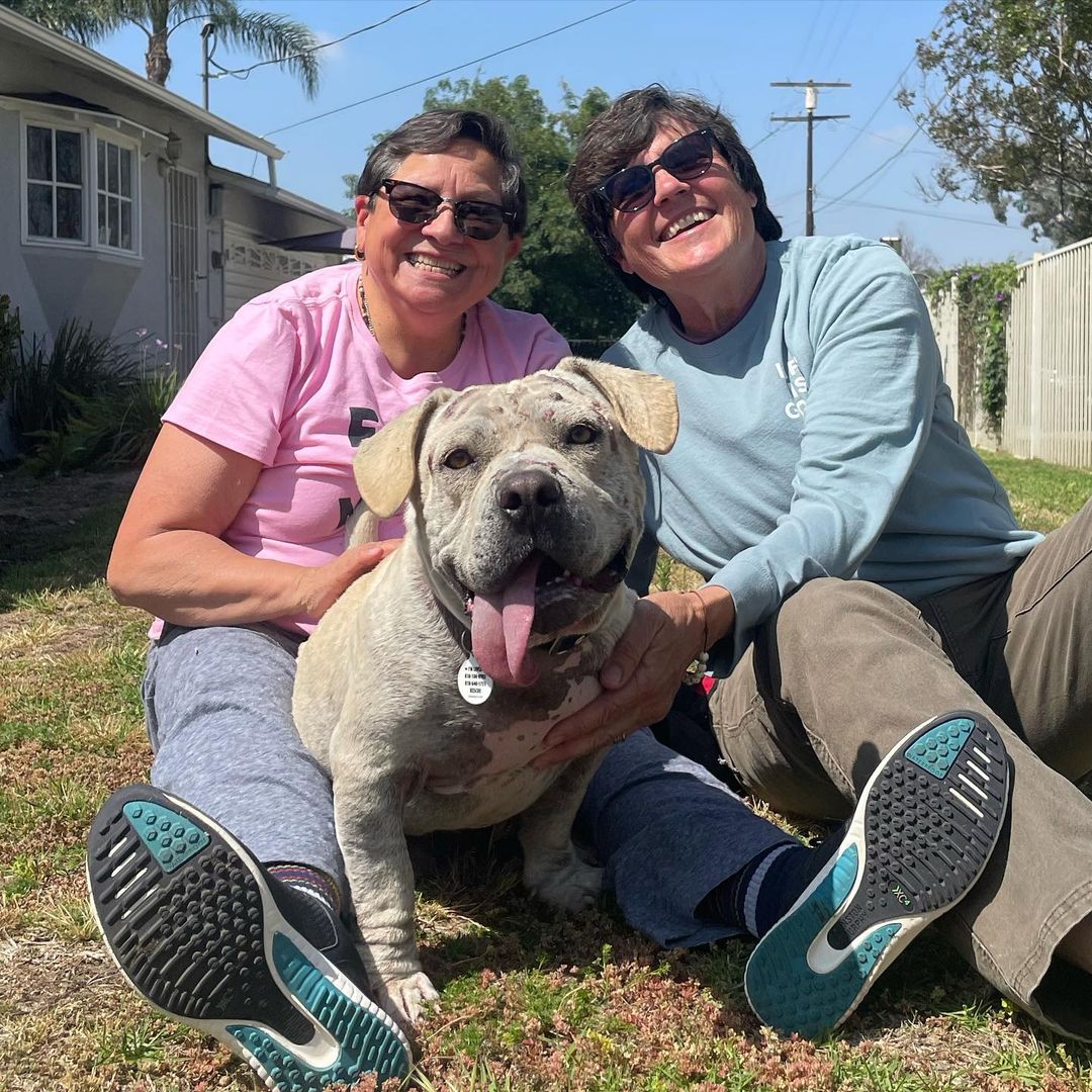 two old humans and dog