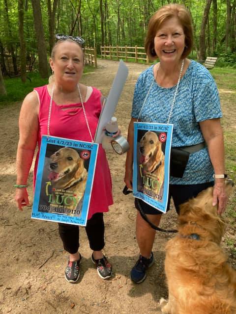 two old women and brown dog