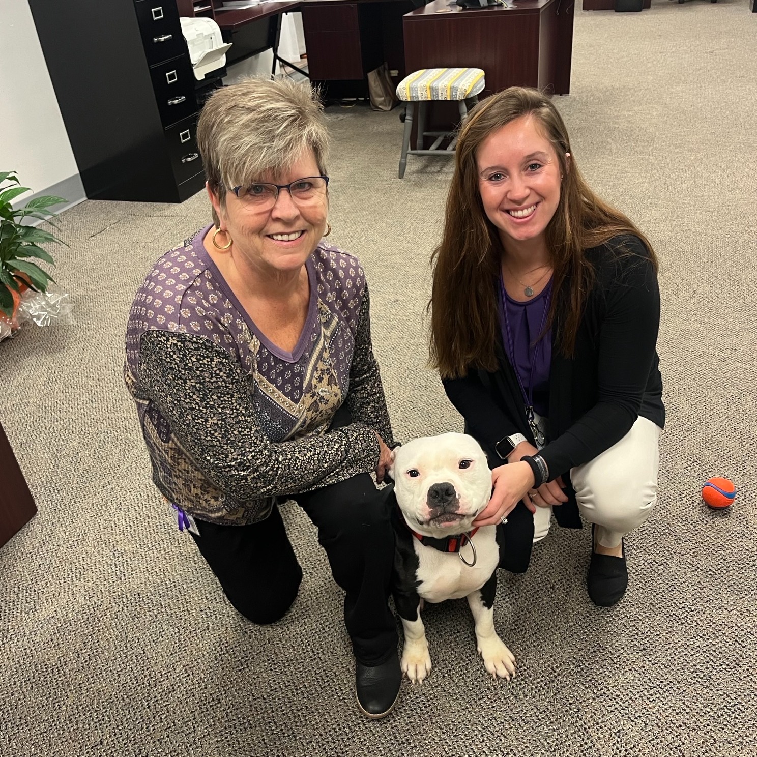 two women and cute dog