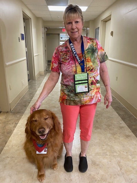 woman and a dog in the hallway