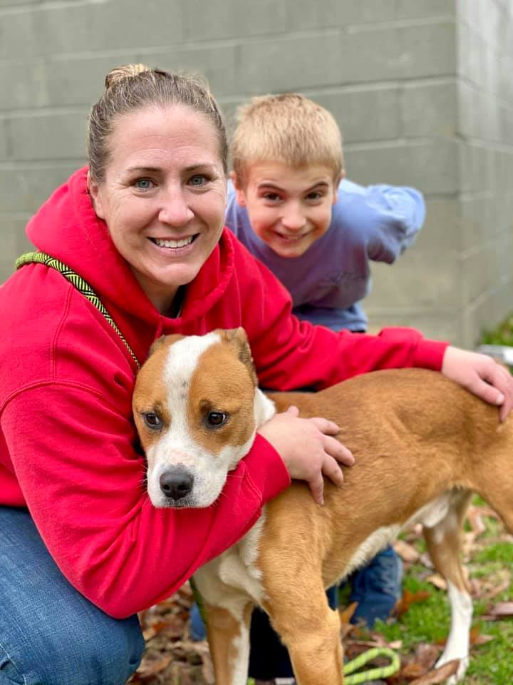 woman and a little boy with a dog