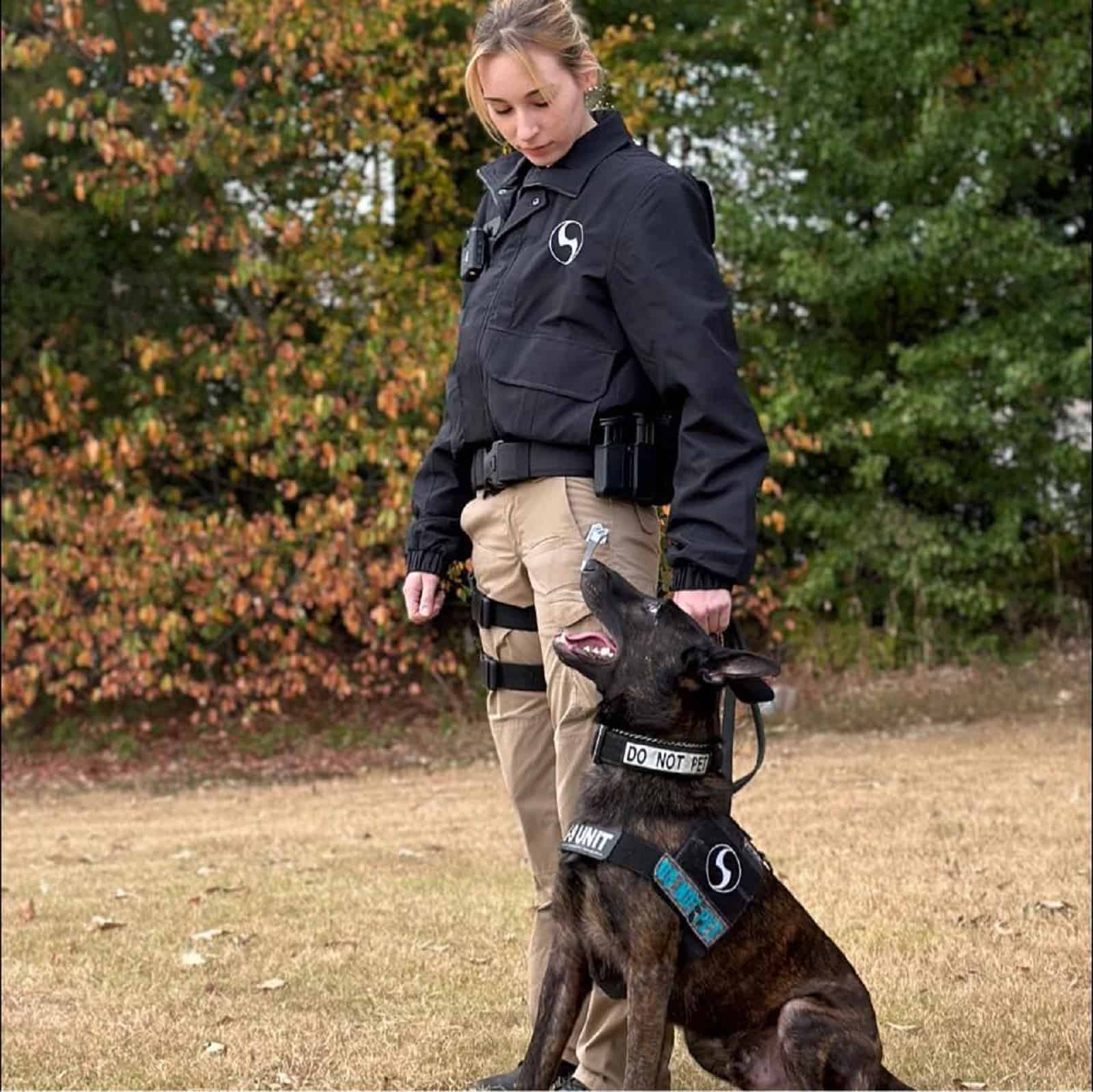 woman and german shepherd dog in the park