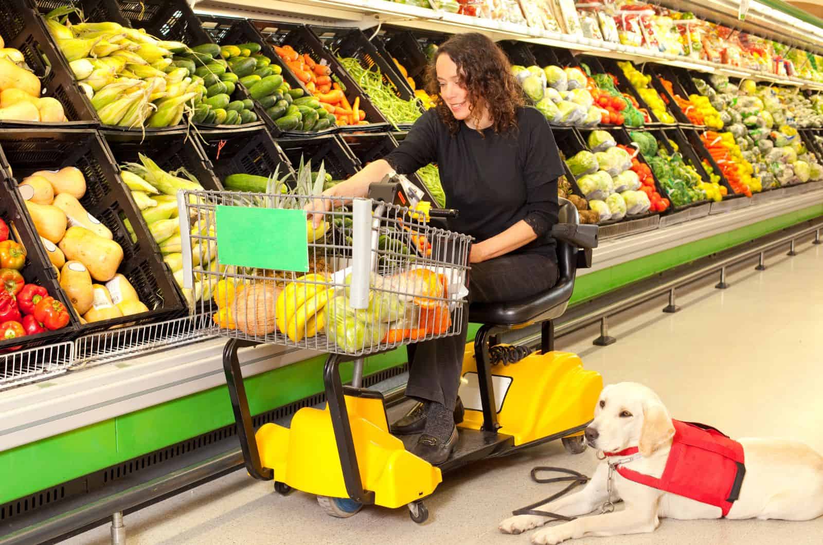 woman and her service dog in store