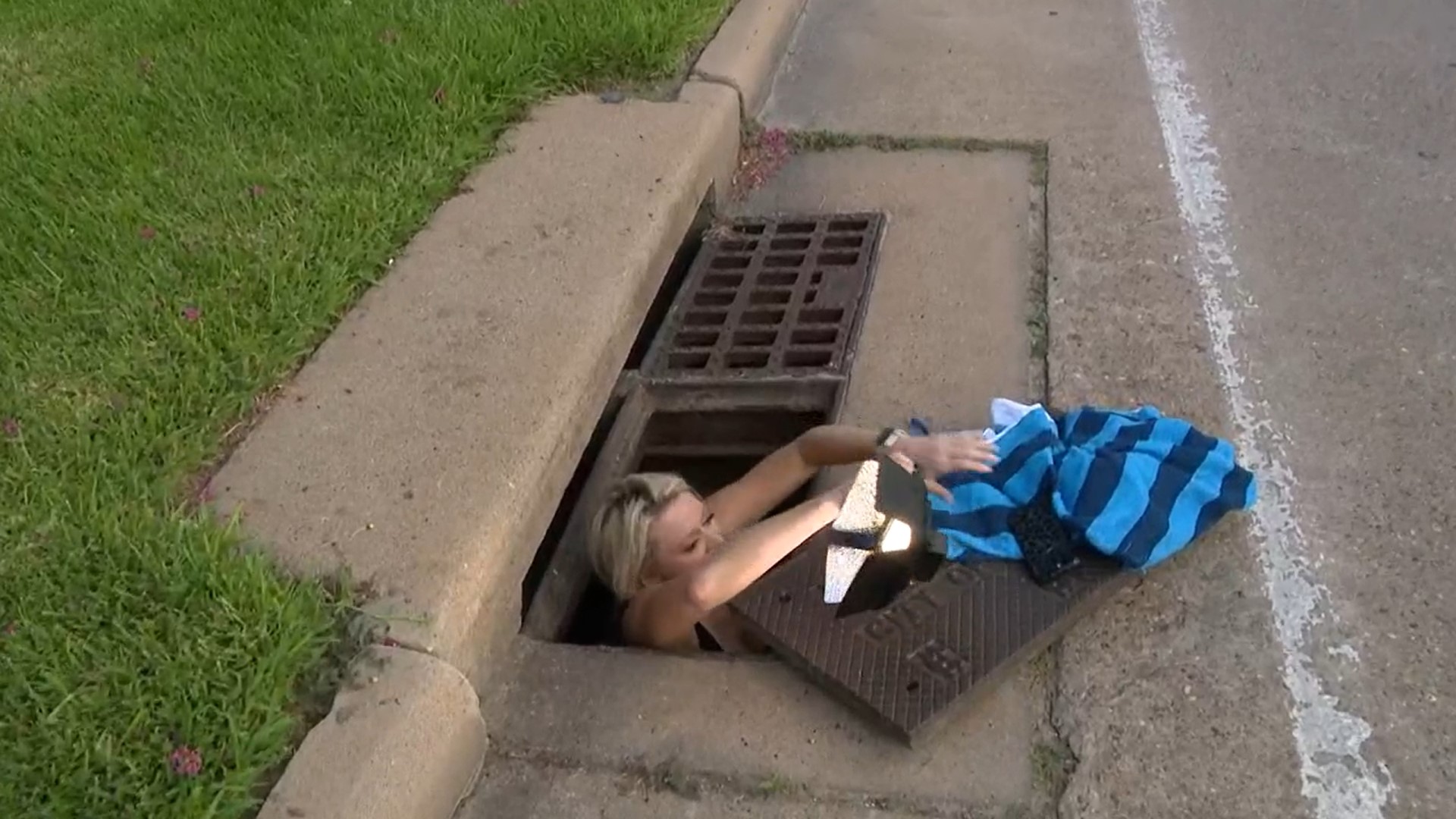 woman getting out of sewer