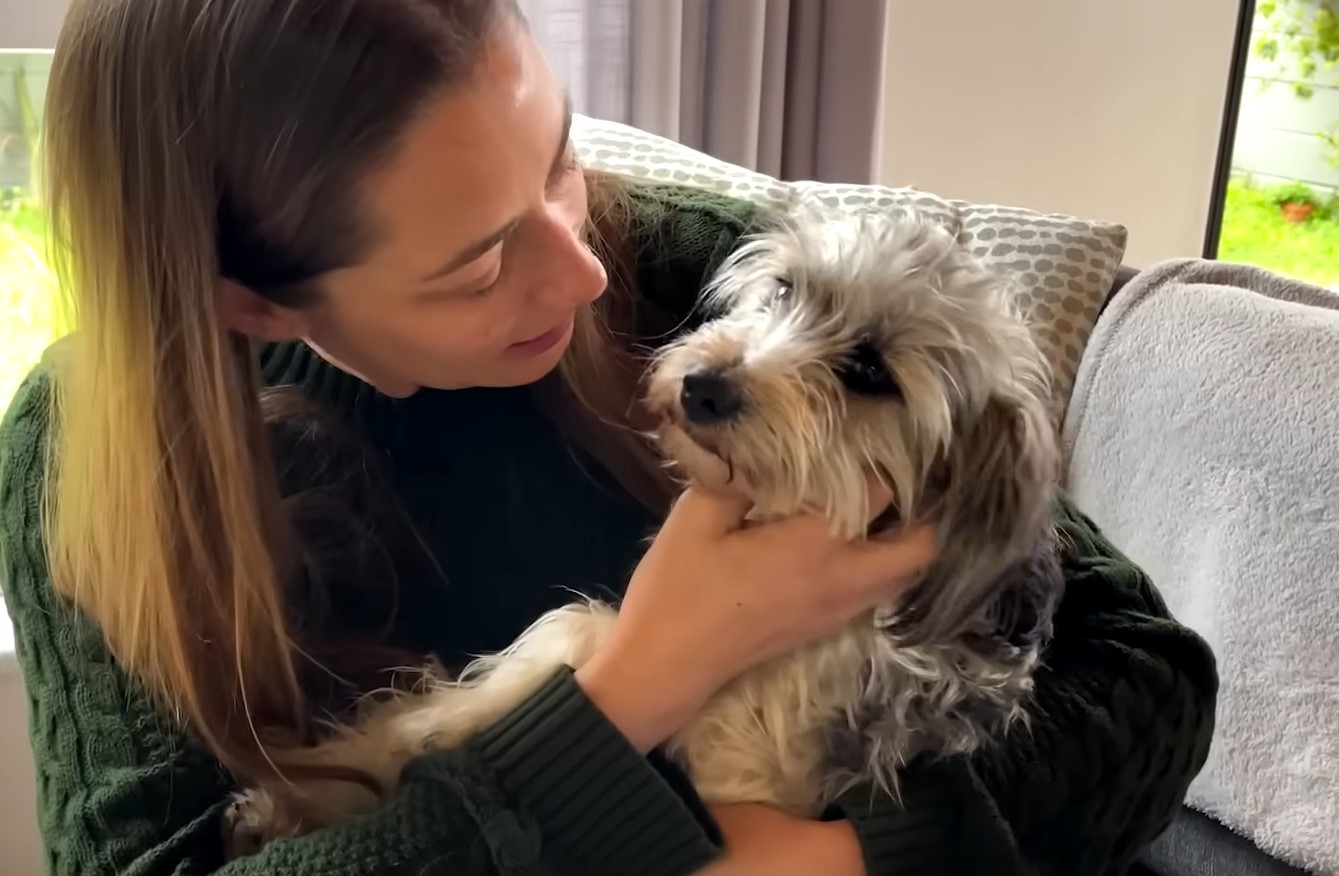 woman holding a dog