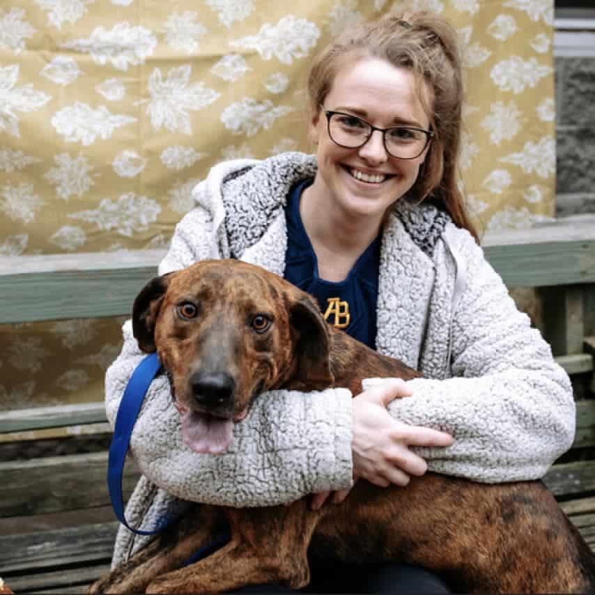 woman holding dog called Picaso